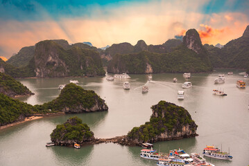 Beautiful landscape of Ha Long bay in Vietnam on sunset, many islands and boats