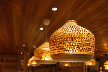 Wall Mural - Three hanging lamps with a woven design. handmade weaving bamboo lanterns.