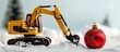 © HN Works - Excavator model and Christmas ornament displayed on a white background symbolizing a festive holiday celebration with a copy space image