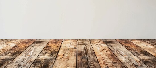 Fototapete - Rustic wooden planks against a white wall providing an empty background for product display and text with a copy space image