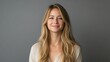 © Maria Mikhaylichenko - Radiant blonde woman with a warm, genuine smile gazes at camera, exuding confidence and approachability against a neutral background, perfect for lifestyle branding.