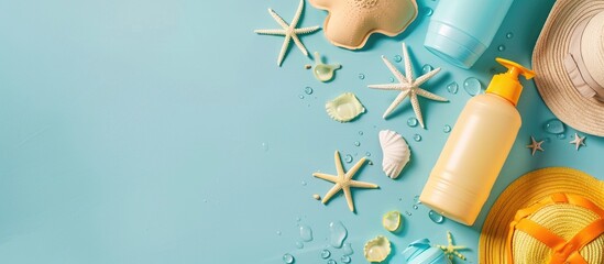 Aufkleber - Top view of sunblock bottles and beach gear on a light blue backdrop with room for text features a copy space image