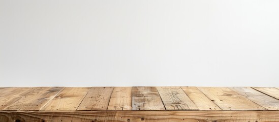 Fototapete - Front view of an empty wooden table with a white background perfect for incorporating a copy space image