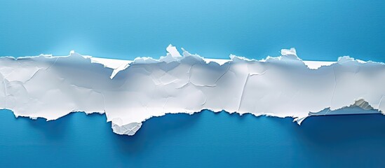 Leinwandbilder - Torn paper against a blue backdrop with copy space image