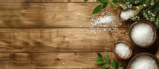 Poster - Spa treatment scene featuring white sea salt on a wooden backdrop with copy space image available for text placement