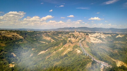 Wall Mural - Approaching medieval town of Civita di Bagnoregio from a drone, Italy.