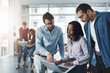 © BestLens/peopleimages.com - Employees, discussion and laptop for training in office, manager helping and internship advice. Staff, public relations agency and review diversity on press release, report and publicity coverage