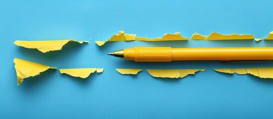 Poster - Five yellow torn papers with a yellow pen on a blue backdrop providing copy space image