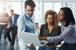 © BestLens/peopleimages.com - Business people, website and laptop for project in office, team helping and advice or support. Staff, public relations agency and review discussion on press release, report and publicity coverage