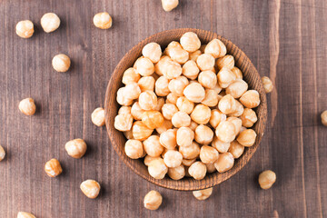 Wall Mural - Organic hazelnuts in a bowl. 