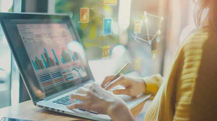 Unrecognizable woman reviewing accounting documents on her computer