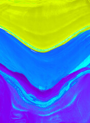 Neon colored background, green, blue and purple paints