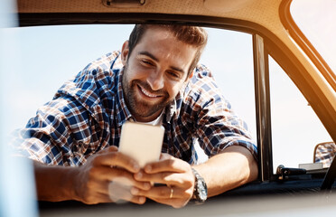 Poster - Road trip, relax and man with phone by car for summer holiday, adventure and update on travel. Happy, person and break with tech by window for communication, tourism and location check in Germany