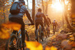© Centric  - A group of friends mountain biking through a forest in autumn, with golden leaves and sunlight streaming through the trees