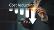 © Montri - Cost reduction business finance concept, budget management and cost management. Businessman show Cost reduction graph with down arrow on virtual screen.