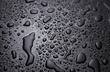 Drops of water on a black surface