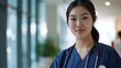 © AlfaSmart - Asian nurse in uniform, set in a hospital or clinic