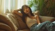 © AlfaSmart - Asian woman in a relaxed pose