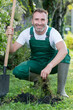 © auremar - portrait of happy senior man gardening outdoors