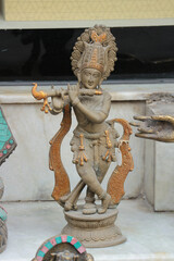 Wall Mural - Bronze figurine of Krishna playing the flute.