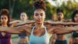 © Johannes - Group of multiethnic women stretching arms outdoor. Yoga class doing breathing exercise at park. Beautiful. fit women doing breath exercise together with outstretched arms.