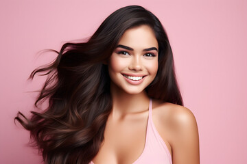 Poster - beautiful woman flaunting her long hair over pink background