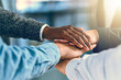 © JordaanExams/peopleimages.com - Business, people and hands with pile for teamwork with employee solidarity, inclusion and equality in workplace. Group success, stack and collaboration with staff support, motivation and celebration