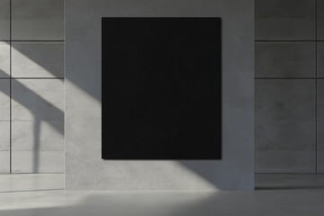 A black vertical canvas on a grey wall in a minimalistic room with sunlight casting shadows, suitable for mockup purposes.