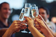 © peopleimages.com - Bubbles, hands and toast with friends outdoor for celebration or social gathering together. Alcohol glass, champagne and cheers with group of people in backyard for milestone or new years for fun
