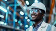 © Oulailux - A man wearing a hard hat and safety glasses is smiling