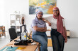 © Studio Marmellata - Two women in hijabs pose confidently in a 3D printing lab, surrounded by equipment and tools. Their stance reflects confidence and pride in their work and achievements in technology.