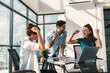 © Summit Art Creations - Group of happy businesspeople celebrate their successful project. Professional business team win and proud of their project at modern office. Successful teamwork, happy colleague, workplace. Tracery.