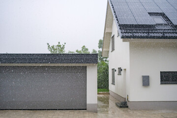 A summer storm, heavy rain in a neighborhood.