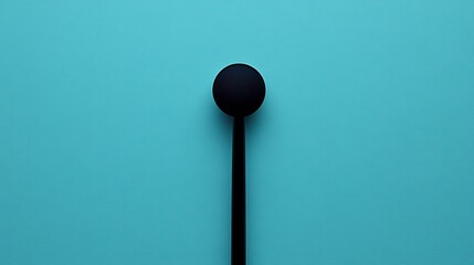 Wall Mural - Minimalist Black Spoon on Turquoise Background