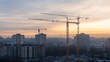© The Little Hut - Tower cranes  at  construction site : Generative AI