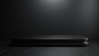 © Aku Creative - 3d rendering of black podium with dark background
