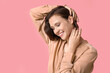 © Pixel-Shot - Beautiful young happy woman wearing stylish golden jewelry on pink background