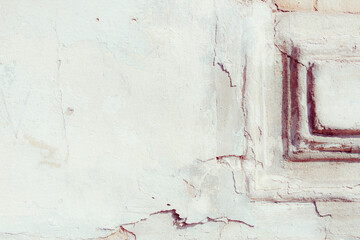 White texture of a concrete wall with natural relief and damage in the form of chips and scratches. Fragment of an old stone surface with a crack. Fragment of a red brick wall with bumps and textured 