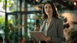 © Keat - Businesswoman holding a tablet uses a microphone to talk to investors interested in artificial intelligence. Camera A