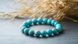 © The Little Hut - Turquoise bracelet Bracelet made of stones on hand from natural stone Turquoise Bracelet made of natural stones Handmade jewelry Handmade bracelets on light modern background : Generative AI
