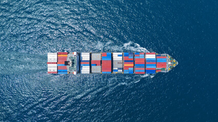 Wall Mural - top view Cargo container ship carrying container and running in the ocean near international container port customs shipyard sea port concept smart logistic service. transportation logistics trading..