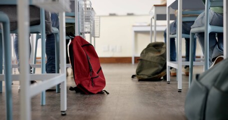 Poster - Classroom, backpack and education in school, students and low angle of learning of kids in academy. Desk, legs and children with scholarship, studying and writing of practice exam, bag and knowledge