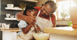 © AzeemudDeen/peopleimages.com - Baking, black child and grandmother in kitchen for support, recipe process and mixing batter at home. Young girl, development or senior woman at counter for trust, growth or encouragement making cake