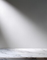 Poster - Elegant marble countertop with soft lighting against a textured light gray wall, suitable for product displays or interior design themes
