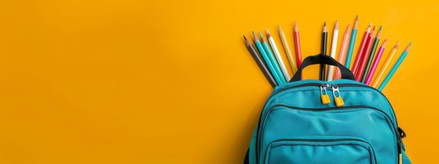 Wall Mural -  A blue backpack, filled with colored pencils, protrudes from its back against a sunny yellow background