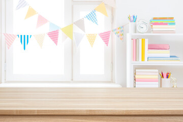 Wall Mural - educational background with wooden tabletop foreground for product montage and defocused decorated r
