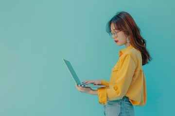 Poster - a person working on a laptop with a yellow shirt