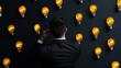 © Aventurine - A man in a suit observes a wall of glowing light bulbs, representing creativity and inspiration in a modern space.