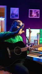 Poster - Vertical Video Professional composer teaching guitar lessons online on master class, recording himself playing acoustic instrument accords and explaining notes for tutorial. Young musician making