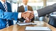 © background - Two Businessmen Shaking Hands in a Meeting